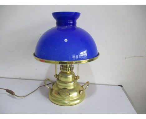 A reproduction  brass ships lamp (S.S Grand River, Saint Louis) with blue glass shade
