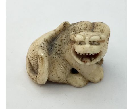 A 19th century stag horn netsuke of a dragon.