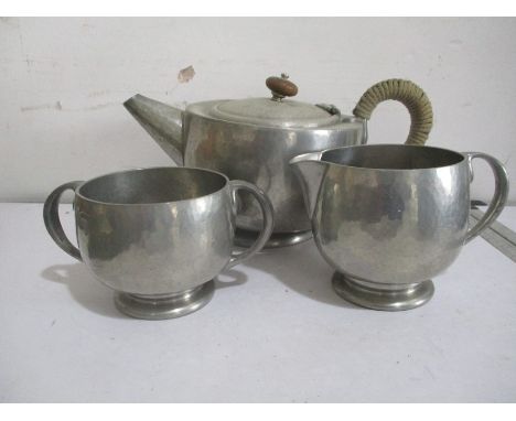 A Tudric, for Liberty &amp; Co hammered pewter tea set- tea pot dented