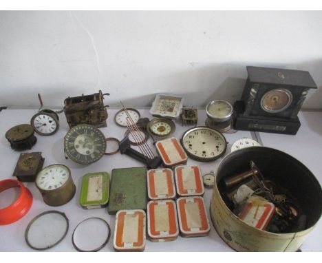 A collection of clock parts, movements, faces, slate mantle clock etc