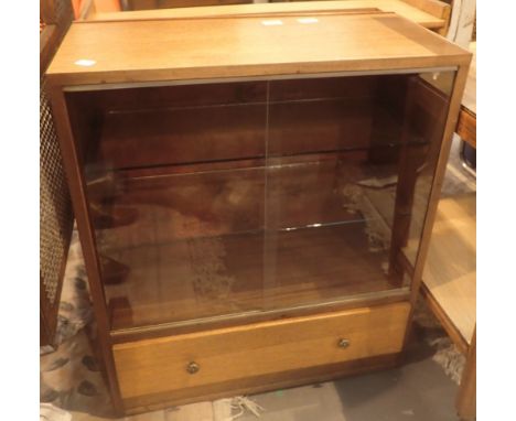 Two wooden two shelf bookcases one with sliding glass doors