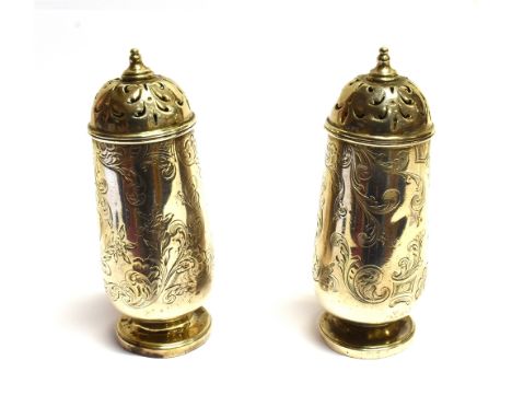 A PAIR OF VICTORIAN SILVER PEPPERETTES  of tapered cylindrical form with engraved floral decoration and lion crest, scroll pi