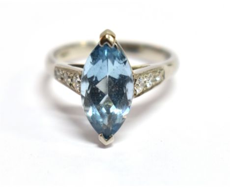 A MODERN AQUAMARINE SINGLE STONE AND DIAMOND SET PLATINUM RING The marquise shaped mixed cut aquamarine 14mm x 7mm, weighing 