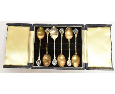 A CASED SET OF SIX SILVER AND ENAMEL COFFEE SPOONS  The cloisonné enamel flower head, finials and stems of multi coloured ena