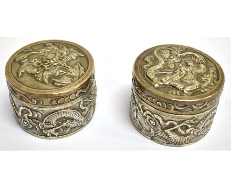 A PAIR OF EARLY 20TH CENTURY CHINESE EXPORT SILVER SMALL CYLINDRICAL BOXES  of liddled form, embossed dragon and floral decor