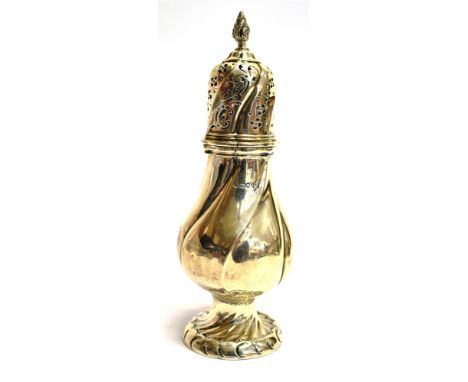 A VICTORIAN SILVER SUGAR CASTER the large caster of spiral facetted bulbous design, flower-head and scroll pierced top with f
