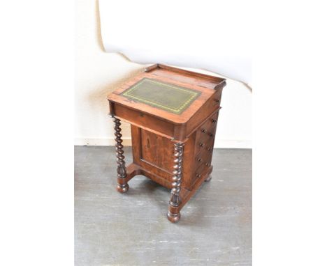 AN EARLY VICTORIAN ROSEWOOD DAVENPORT DESK  the slope top with gilt tooled green leather inset writing surface, opening to sa