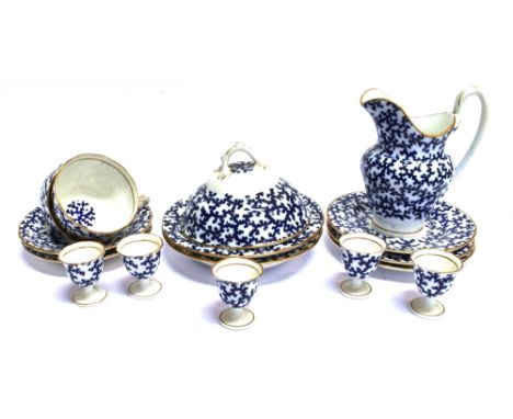 A GROUP OF WORCESTER PORCELAIN TEAWARES  with underglaze blue 'seaweed' decoration within gilt borders, red painted 'worceste