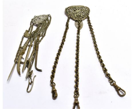 TWO WHITE METAL VICTORIAN CHATALAINES  one continental unmarked example with dragon fly and floral scroll decoration to a sev