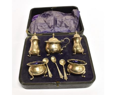 A BOXED SILVER FIVE PIECE CONDIMENT SET comprising two salts, two pepperettes and mustard, complete with three condiment spoo