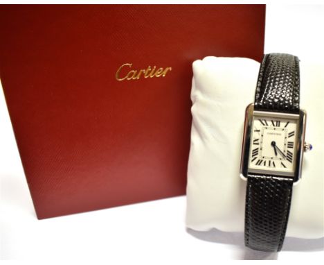 A LADIES CARTIER TANK STAINLESS STEEL WATCH On a leather strap, ivory coloured oblong dial, black Roman numerals, Quartz batt