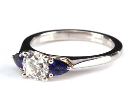 † Ingle & Rhode Overture ring, set with a 0.70 carat round brilliant cut lab grown diamond, with a sapphire set each side, mo