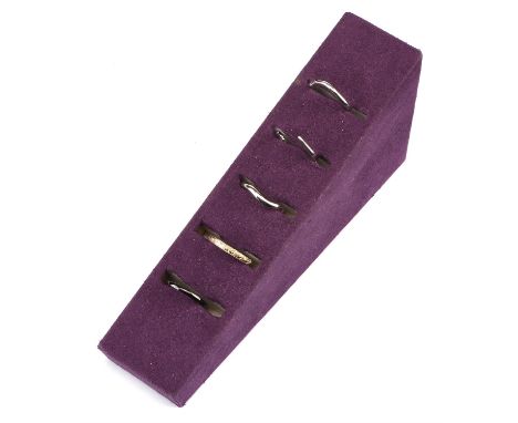 † A selection of five wedding bands, including a 2.5mm court wedding ring, size K, in 18ct white gold, with a black rhodium f