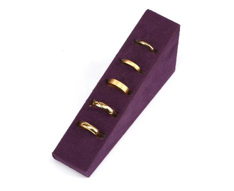 † A selection of five wedding bands, including a 3mm d-shaped band, size M, a 4mm court band with a brushed finish, size J, a