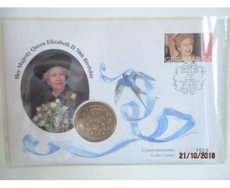 An album containing commemorative Jersey &amp; Guernsey first day and coin covers to include various silver and gold coins, d