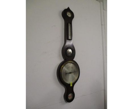 A 19th century oak wheel barometer with silvered dial 