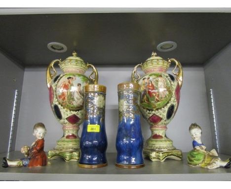 A pair of 19th century Doulton vases, floral pattern on a blue ground, a pair of Royal Vienna, twin handled pottery mantle va