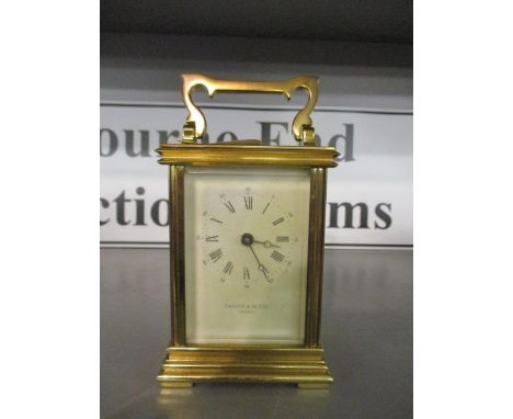 An early 20th century brass cased carriage clock, the dial inscribed Taylor &amp; Bligh, London Gh 