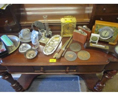 A white metal Sheraton Skyline Hotel 1971-1981 presentation ashtray, three silver decanter labels, a carriage clock and mixed