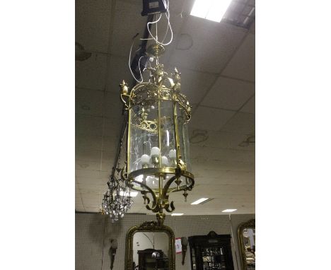 A CONTINENTAL GILT BRASS AND ENGRAVED GLASS FOUR LIGHT HALL LANTERN of cylindrical form with pierced circlet