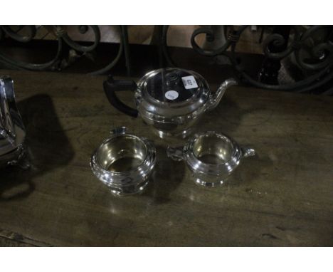 A THREE PIECE SHEFFIELD PLATED TEA SERVICE with ebonised handle 