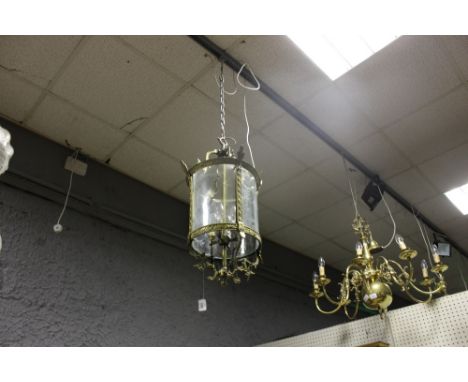 A GILT BRASS AND ENGRAVED GLASS FOUR LIGHT HALL LANTERN of cylindrical form with etched glass panels