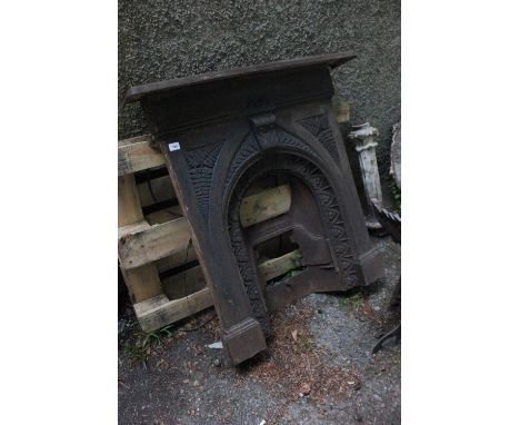 A VICTORIAN CAST IRON FIREPLACE the rectangular shelf above a moulded frieze with fern decoration and arched inset 104cm (h) 