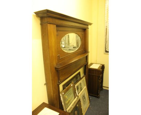 A c.1950 MAHOGANY CHIMNEY PIECE with oval bevelled glass mirror above a moulded shelf raised on rectangular jabs 183cm (h) x 