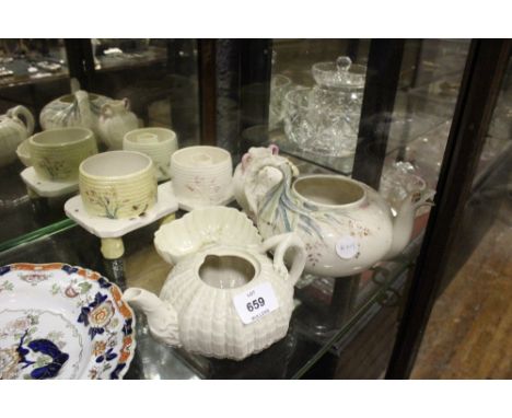 A COLLECTION OF BELLEEK to include a first period teapot, honey pots, heart shaped dish (6)
