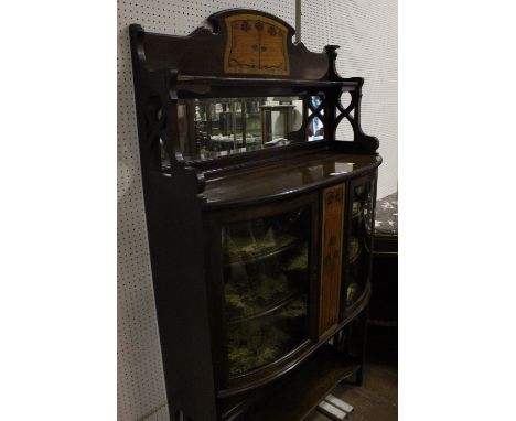 AN ART DECO MAHOGANY AND SATINWOOD INLAID CHINA DISPLAY CABINET of demi-lune outline the super structure with moulded shelf a