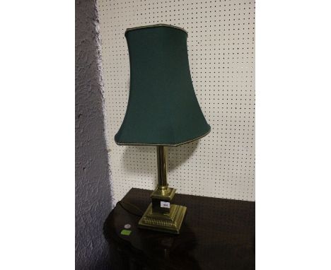 A BRASS CORINTHIAN COLUMN TABLE LAMP raised on a square stepped base with shade 72cm high