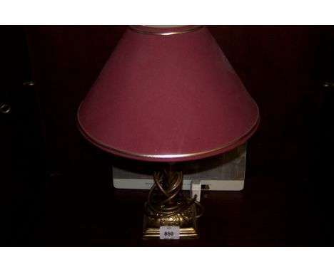 A BRASS TABLE LAMP the cylindrical column above a square stepped base with shade