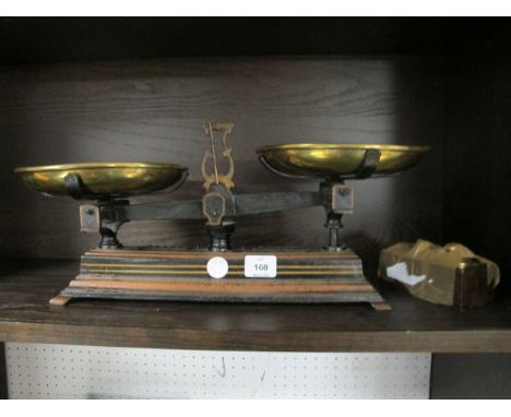 A CAST IRON AND BRASS WEIGH SCALES with weights