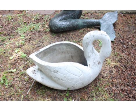 A COMPOSITION STONE PLANTER modelled as a swan 40cm high