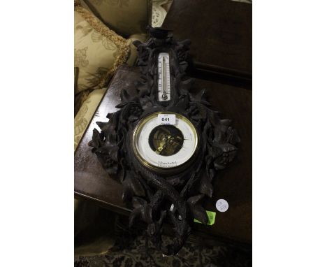 A BLACK FOREST CASED BAROMETER AND THERMOMETER inscribed "T Downie Hamburg" 62cm (h) x 35cm (w)