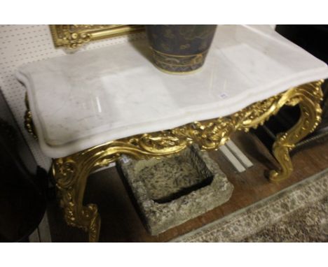 A FINE CONTINENTAL CARVED GILTWOOD CONSOLE TABLE of serpentine outline surmounted with a white vein marble top above a pierce