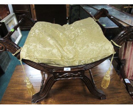 A STAINED BEECHWOOD STOOL the upholstered seat with loose cushion raised on an X shaped frame