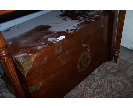 AN ORIENTAL HARDWOOD AND BRASS BOUND TRUNK with hinged lid on bracket feet