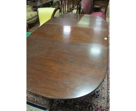 A GEORGIAN STYLE MAHOGANY D-END DINING TABLE the rectangular top with rounded ends and one loose leaf raised on twin tripod s