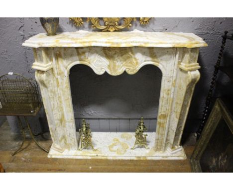 A WHITE AND SIENNA MARBLE CHIMNEY PIECE the serpentine stepped moulded shelf raised on panelled jabs with scroll capitals and