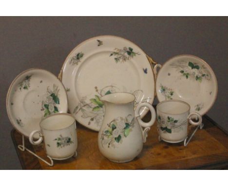 A TWENTY SIX PIECE FIRST PERIOD BELLEEK TEA SET the white ground with green and white floral sprays