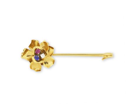 CARTIER: BROCHE RUBIS, SAPHIR ET DIAMANTA motif de fleur, sertie au centre d'un rubis, d'un saphir et d'un diamant de taille 