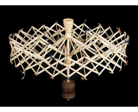 * Sewing. A large expanding whalebone swift, early-mid 19th century, double-cage umbrella swift, turned ivory yarn cup suppor