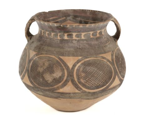 * Funerary Pot. A Chinese Neolithic earthenware funerary pot, circa 2000 BC, the ovoid two handle pot painted with black net 