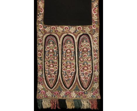 * Shawls. A long Delhi shawl, mid-late 19th century, densely hand-embroidered in polychrome silk threads on a fine black net 