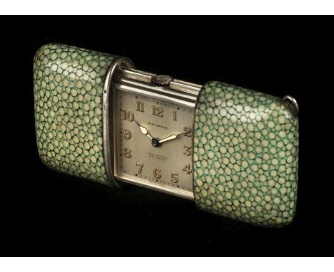 * Purse Watch. An art deco Movado purse watch, with silvered dial illuminated hands and Arabic numerals, sterling silver case