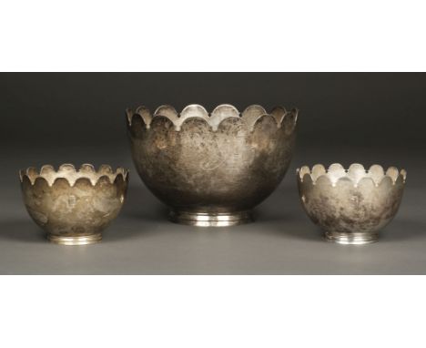 * Bowls. A large silver monteith style bowl by Elkington &amp; Company, London 1912, engraved with a barrel and arrow with pr