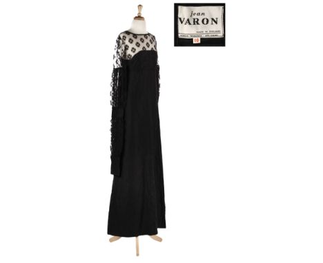 * Clothing. A black evening gown, John Varon, 1970s, full-length black taffeta evening gown, black lace bodice and long sleev