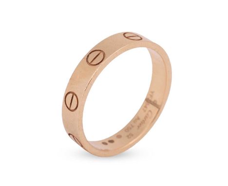 Cartier - an 18ct yellow gold "Love" ring; the polished, square-edged band of 3.5mm, decorated with eight screwhead motifs, s