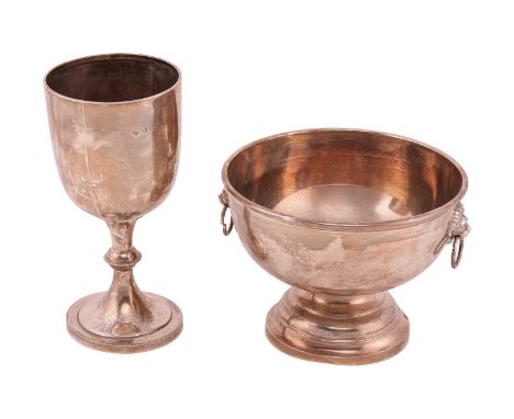A silver rosewater bowl, with lion mask ring handles and stepped circular foot, Birmingham 1970 by Roberts & Dore Ltd. 13cm h